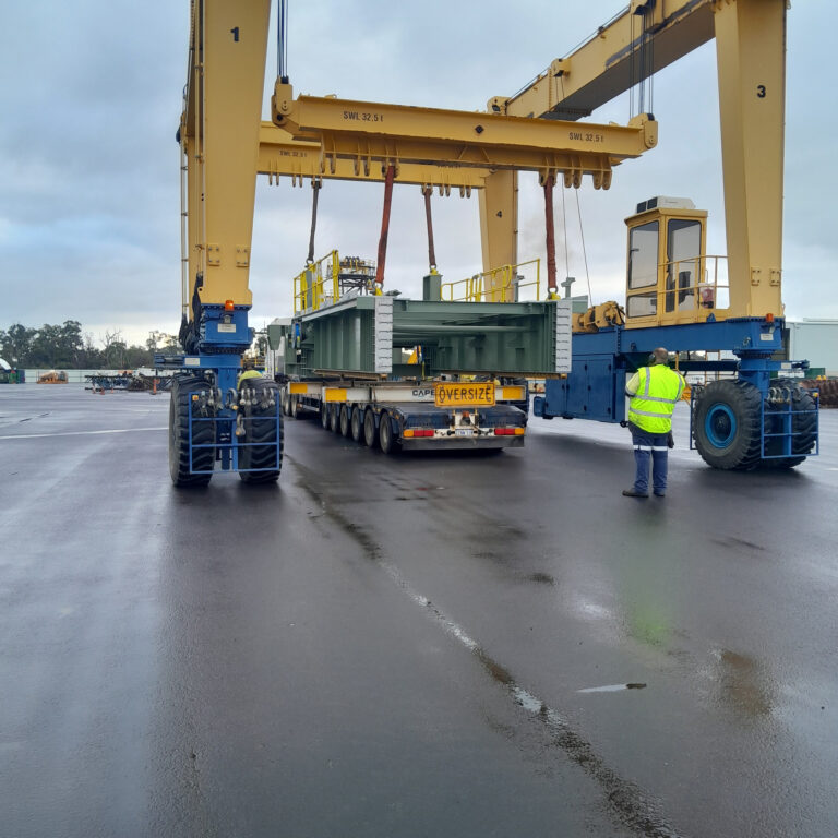 Heavy machinery transport on multi-axle trailer